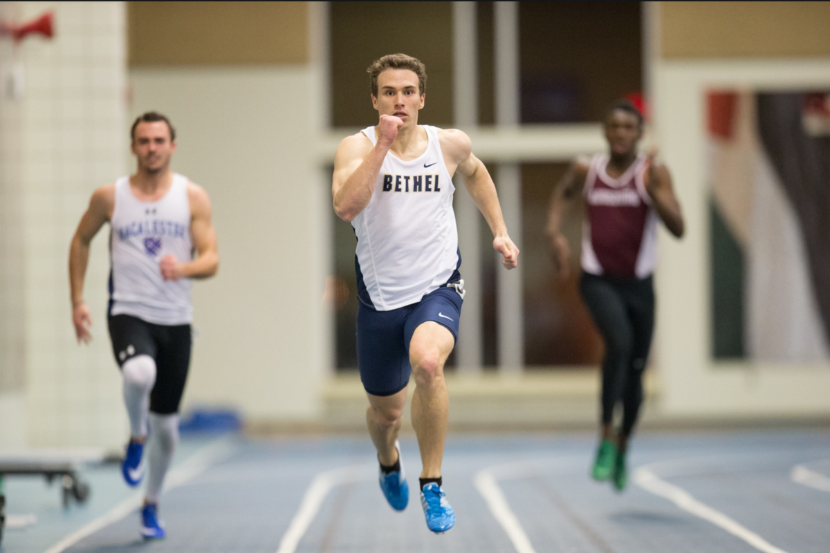 Junior+Karl+Olsen+concentrates+on+the+finish+line+halfway+through+the+200+meter+dash+at+Macalester+College+Jan.+20.+Olsen+completed+the+race+in+22.45+seconds%2C+breaking+the+all+time+school+record+of+23+years+by+.03+seconds.+%7C+PHOTO+BY+NATHAN+KLOK