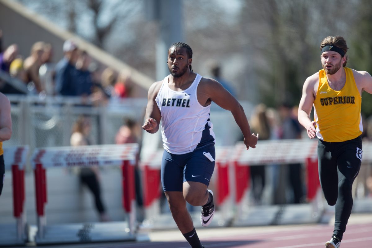 +Tensaie+sprints+past+his+competition+last+Saturday+at+the+Hamline+Invitational.+As+a+student-athlete+of+color%2C+Tensaie+believes+the+lack+of+diversity+causes+people+to+second-guess+Bethel.+%E2%80%9CI%E2%80%99ve+gone+to+predominantly+white%2C+Christian+school+all+through+school+so+I+was+used+to+it%E2%80%9D+said+Tensaie+on+his+expectations+on+Bethel.+%E2%80%9CBut+coming+here%2C+it+was+different.%E2%80%9D+%7C+Photo+by+Nathan+Klok