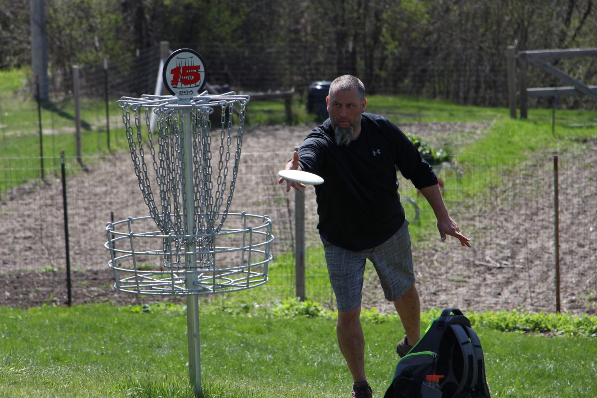 Biblical and theological studies professor Jim Beilby throws a putt. Beilby participated in the
professional tournament on Sunday, April 23. | Photo by Josh Towner