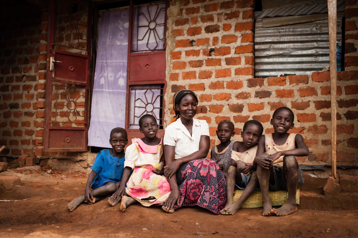 A+widow+sits+on+the+ground+with+her+children.+IJM+helped+restore+her+land+to+her.+%7C+Photo+by+Sean+Sheridan