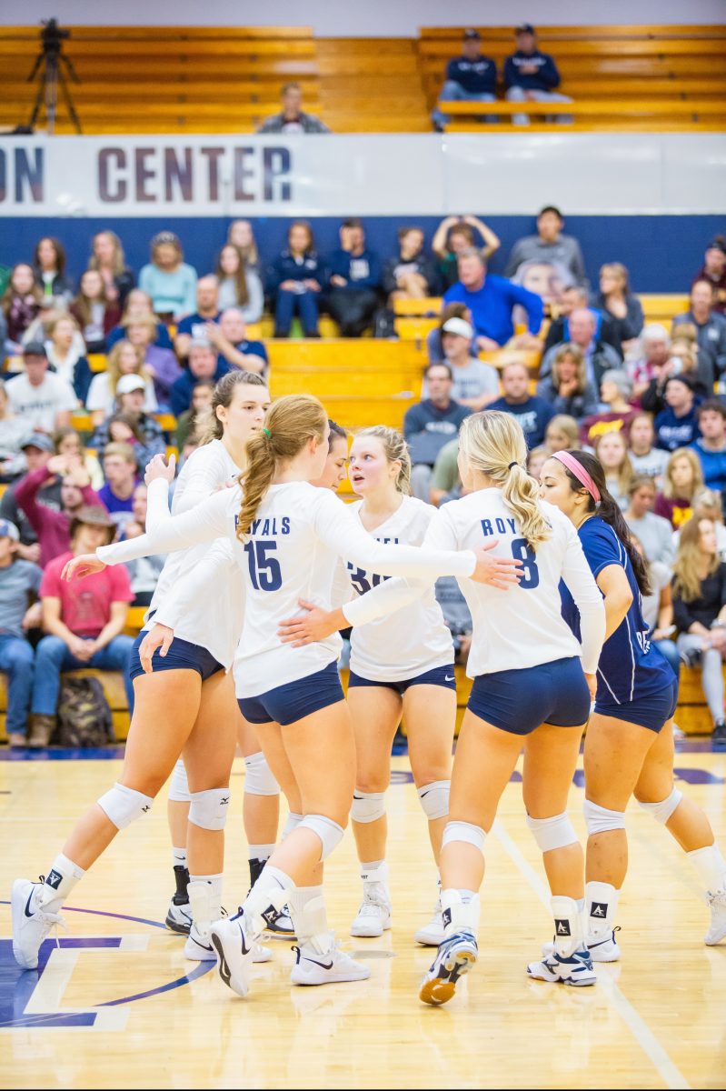 The+Bethel+Royals+volleyball+team+celebrates+together+after+winning+a+point+Sept.+21+against+UW-Stout.