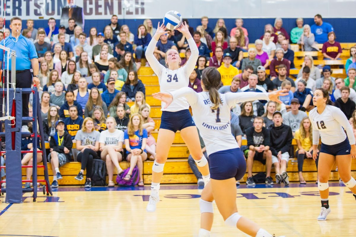 Freshman+Hannah+Wilhite+sets+up+a+teammate+for+a+kill+in+the+Bethel+home+opener+on+Sept.+4.+%7C+Photo+by+Carlo+Holmberg