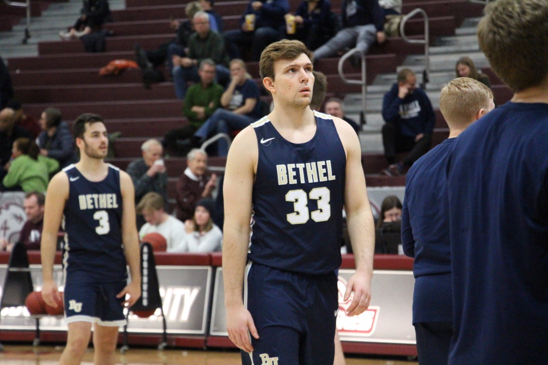 Bethel senior center Derek Magnuson warms up pregame. The Bethel bigman had 24 points and 5 rebounds at Augsburg University wednesday night. Photo by Taylor Fondie