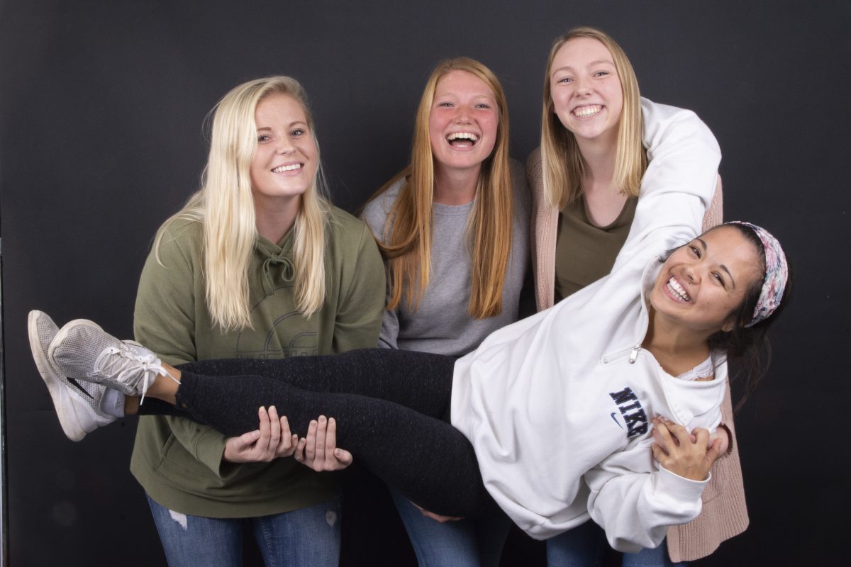 The four Bethel volleyball seniors are tight-knit when on the Robertson Center court, but even more so when not in uniform. | Photo by Emma Gottschalk