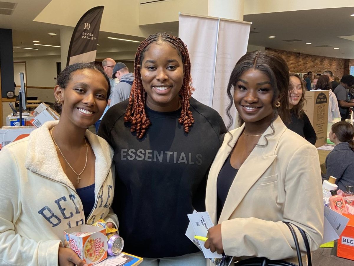 Misgana Mamo, Jesica Amegatse and Nissi Babalola walked together to each table in the Brushaber Commons atrium yesterday morning. The three upperclassmen looked together for a community to get involved with. “We’re looking for a young adults group to get connected with,” Mamo said. 