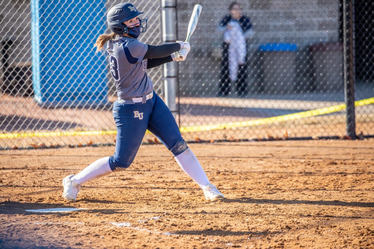 Junior utility player Kaya Hokansen takes a swing at University of Wisconsin Eau Claire field on Mar. 12. The Royals’s softball team beat the Blugolds 9-2 in this second game of the double header. “We have faced a lot of hardship within the past year, for obvious reasons,” Hokansen said. “It's fun to get back to playing a somewhat normal season given the circumstances and not really getting to play last year.”