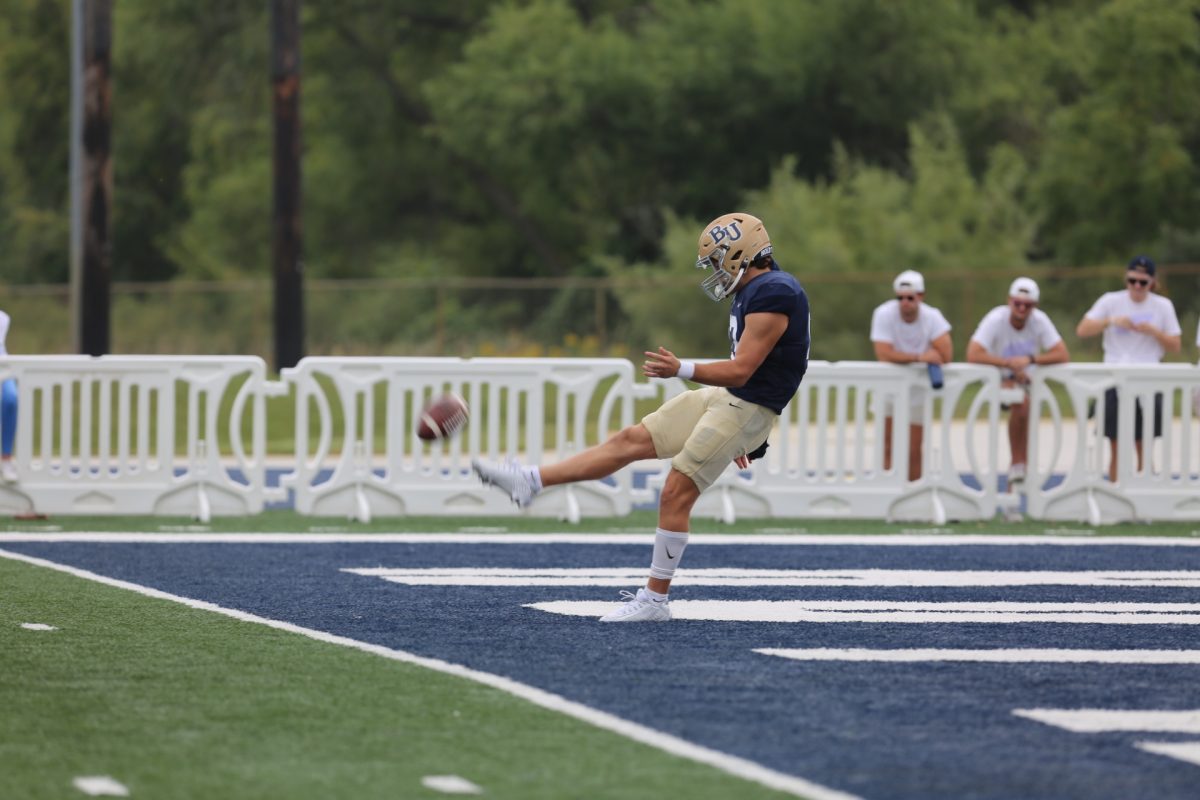 Wide receiver Will Eliason kicks a punt return during the Royals game against the Wartburg Knights. The next Bethel football showing be their homecoming game next Saturday, Sept. 30, against Gustavus Adolphus. 
