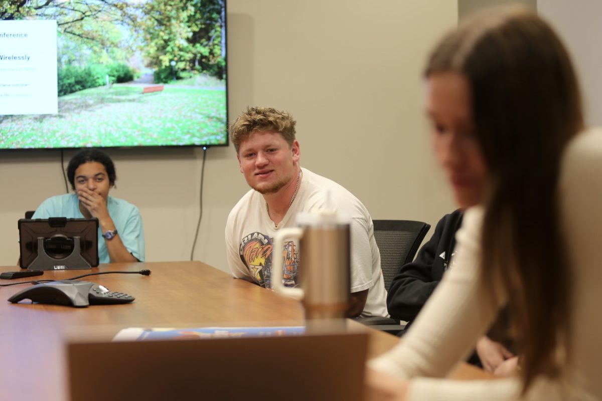 Junior Isaac Lange leans toward the presentation in Wednesday’s BBEA meeting. Lange is a director in BBEA,a marketing major and a football player. “[Business students should] jump in,” Lange said. “You’ll never know if you’ll like something unless you do it.”