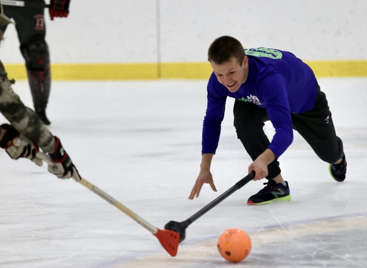 Senior Travis Jensen extends his stick and approaches the ball in an attempt to knock it away from the opposing team. Team “What’s Broomball?” finishes the game just short of victory over team “Leave Broom for Jesus” in a 1-1 tie.