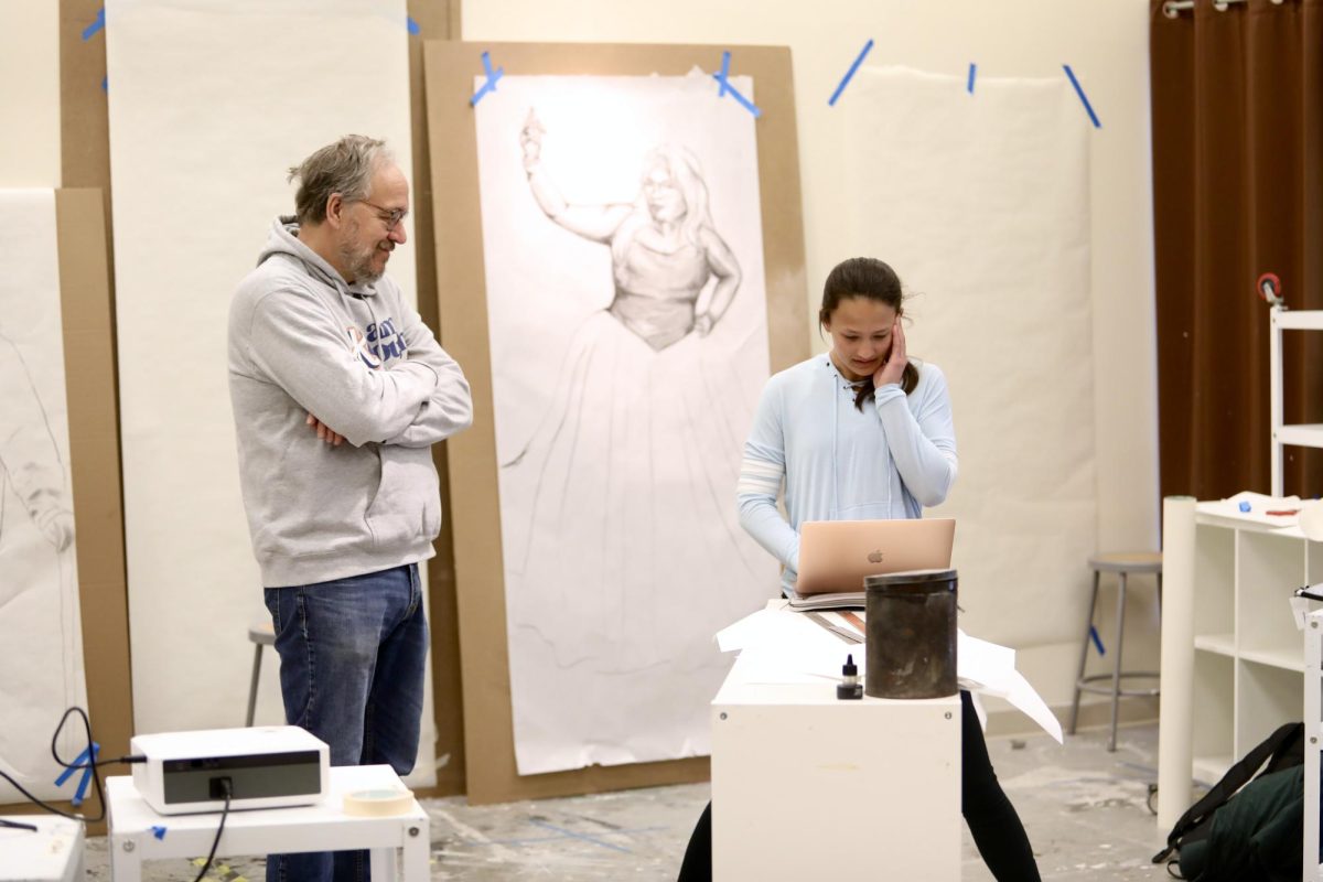 Art professor Ken Steinbach works with freshman Reanna Cruz on her Drawing I project in the art department March 26. “The art department wants to see the best of you,” senior art major Annah Chriske said. “I’ve never had a bad experience with an art professor.”