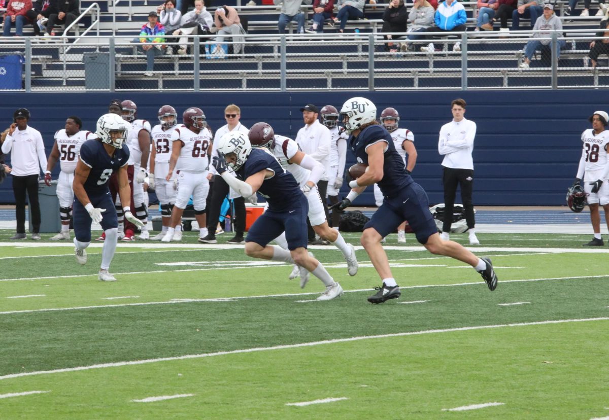 Junior defensive back Matt Jung returns his nation leading sixth interception during the second quarter of the Royals 73-8 win over Augsburg University on Saturday Oct. 22. Jung currently leads the Royals in tackles (27) and interceptions (7) in 2024. “I definitely could say I’m more of a leader this year,” Jung said. “I feel like guys listen to me more now, after I’ve been here a whole season. But at the same time everyone’s making plays.”