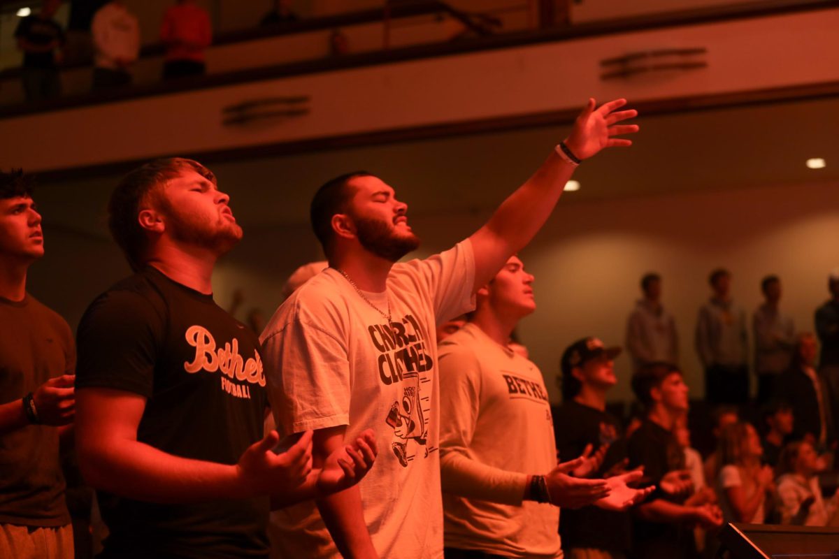 Bethel University students worship during chapel service, Wednesday Sept. 25, 2024. The “Come and See” Chapel series is a deep dive into the Gospel of John, beckoning students to experience the fullness of the Lord. “For the first time, at Bethel, the entire community is studying the Gospel of John. We’re doing the same thing, talking the same language, pursuing and asking to hear from God using the same content. It unifies our campus in a unique and neat way,” campus pastor, Nick Cocalis, said. 