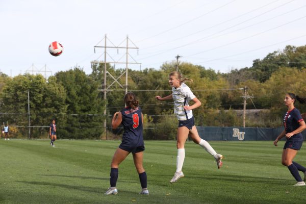 Bethel Freshman Kendall Craigan clears the defensive zone with a header. 