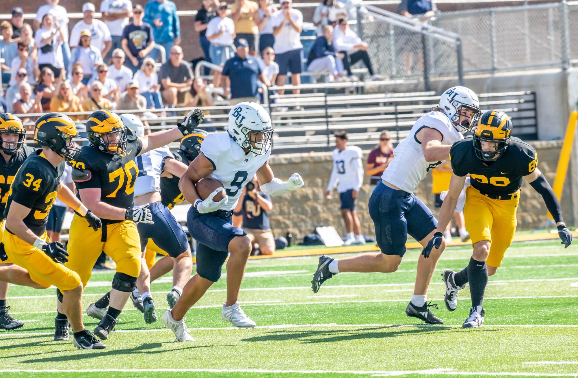 Junior defensive back  Devin Williams returns a tipped interception 62-yards, setting up the Royals offense in prime field position early in their 43-0 win over Gustavus Adolphus College Saturday afternoon. The Royals forced four turnovers on defense, with Williams picking off two Sandven passes in a game where they held the Gusties to just 65 yards on offense. “After taking a tough loss to the Johnnies last week, this week was a little more dialed in, had a lot more fun. I think that’s the reason we were able to come out on top as a defense.” Williams said. | Photo by Bennett Moger