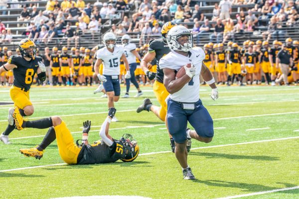 Junior running back David Geebli races past the Gustie secondary for a 54 yard touchdown run to put the Royals up 22-0 in the second quarter. Geebli rushed for 83 yards and one touchdown as Bethel took down Gustavus 43-0 on Saturday afternoon. | Photo by Bennett Moger 