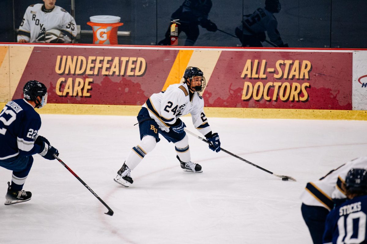 Junior winger Tlyer Braccini carries the puck into the Stout defensive zone during the Royals 5-3 win over the University of Wisconsin-Stout Friday night at Bethel University Arena. Braccini accounted for three of the Royals five goals and tallied his first career hat trick in the win.