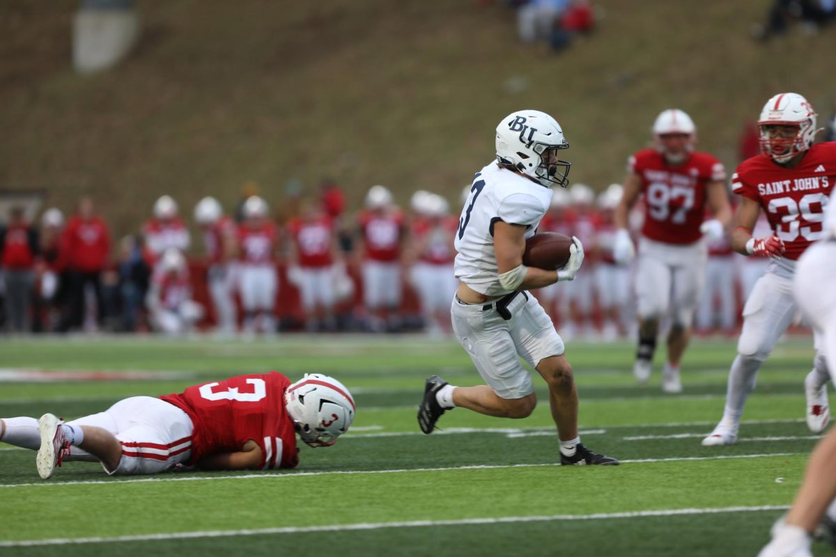 Bethel University wide receiver Will Eliason sprints into the open field on a 19-yard reception during the fourth quarter of the Royals loss to St.John’s University on Saturday afternoon at Clemens Stadium. The Royals amassed 411 yards of total offense in the 41-33 loss to the Johnnies. 