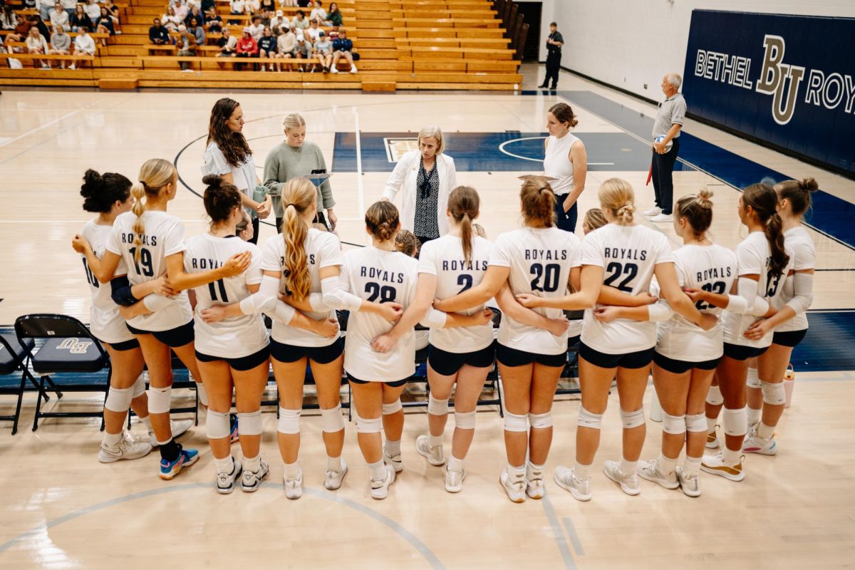 Bethel head coach Gretchen Hunt talks to her team during a timeout in Bethel's October 2 game against Macalester.