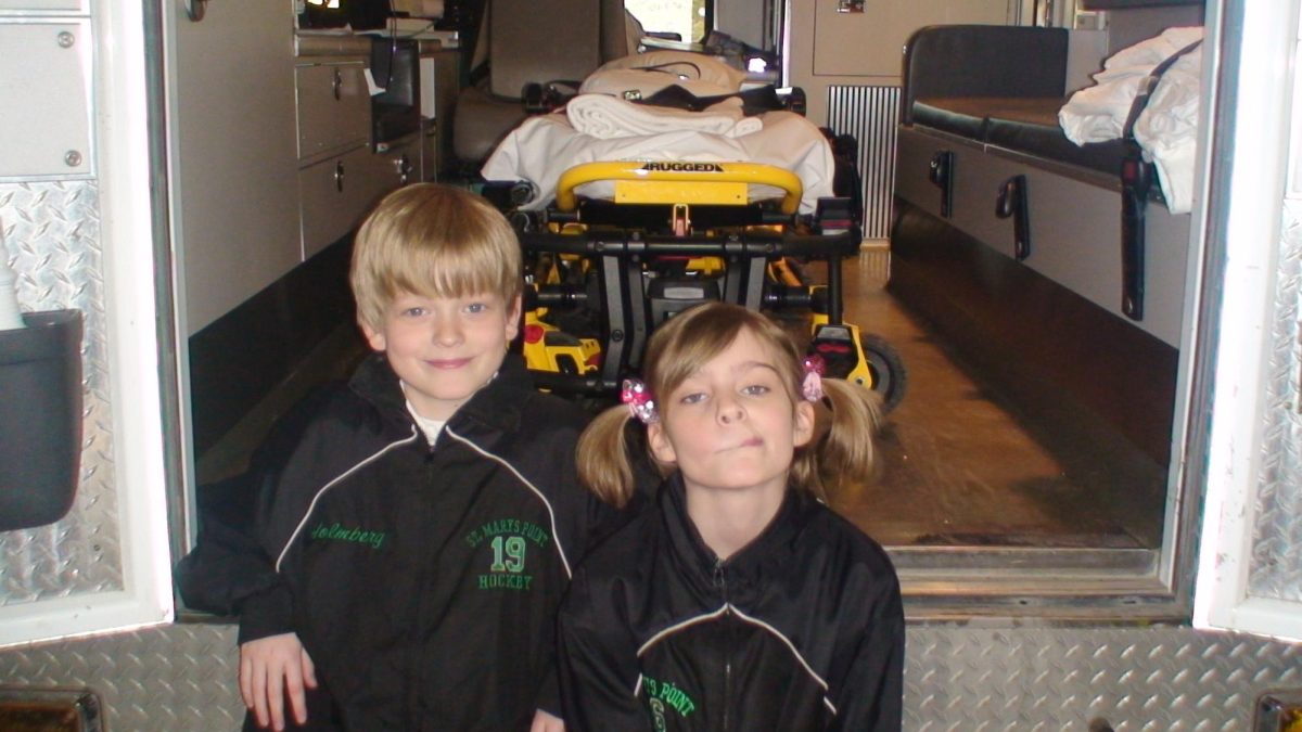 Amy Holmberg poses with her older brother sporting their matching St. Mary's Point hockey jackets. Pigtails had been her go-to style until learning later that maybe they weren't as cool as she thought. | Photo submitted by Amy Holmberg. 