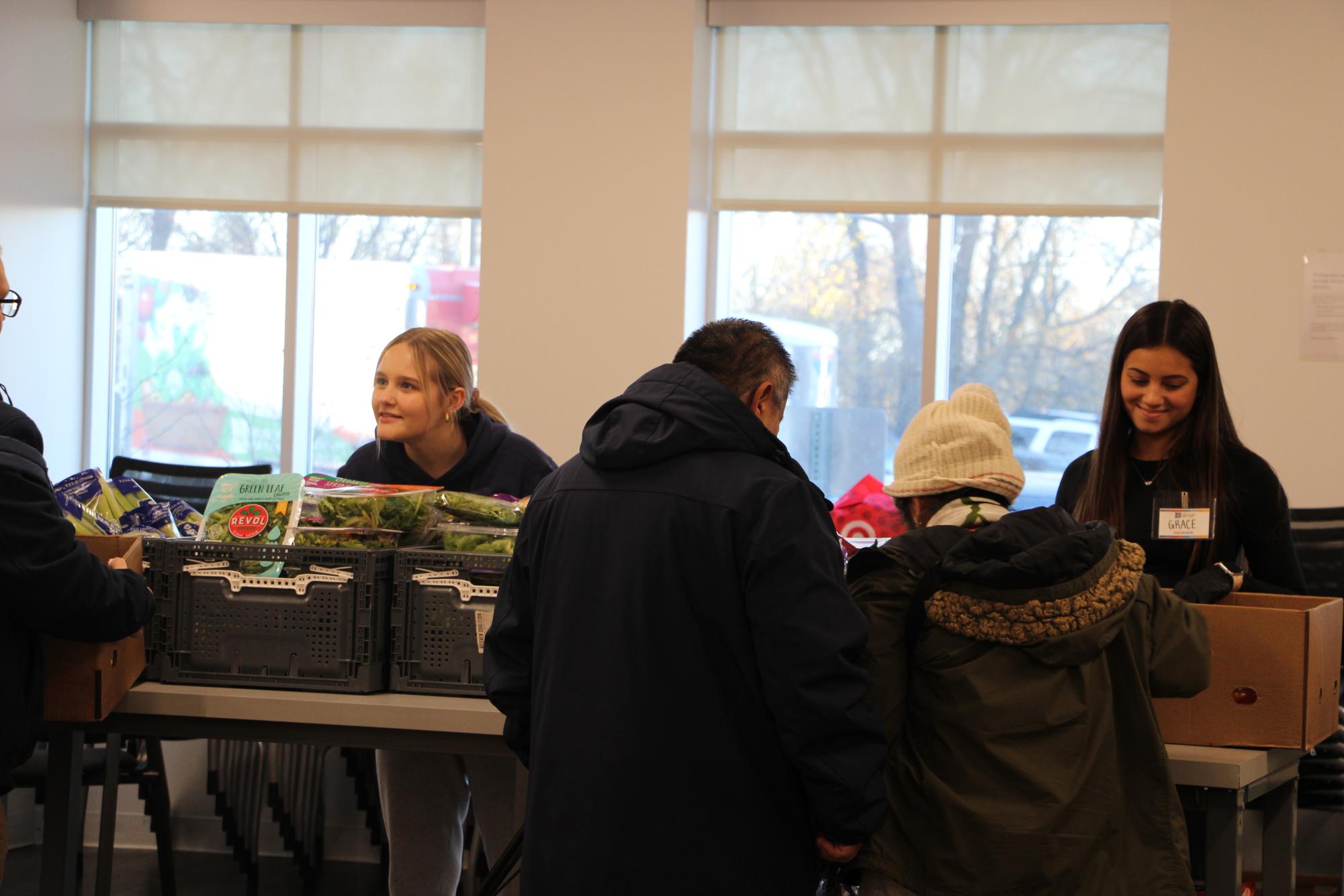 Bethel students Alivia Wulff and Grace Christensen serve CLUES by providing food to its clients and restocking items in the food shelf. At the food shelf, Wulff and Christensen interact with Hispanic clients and families. “It's just been really eye opening to see the same families come every week and they have their kids with them, and they're just all so happy and funny and just very nice and warm,” Wulff said. 