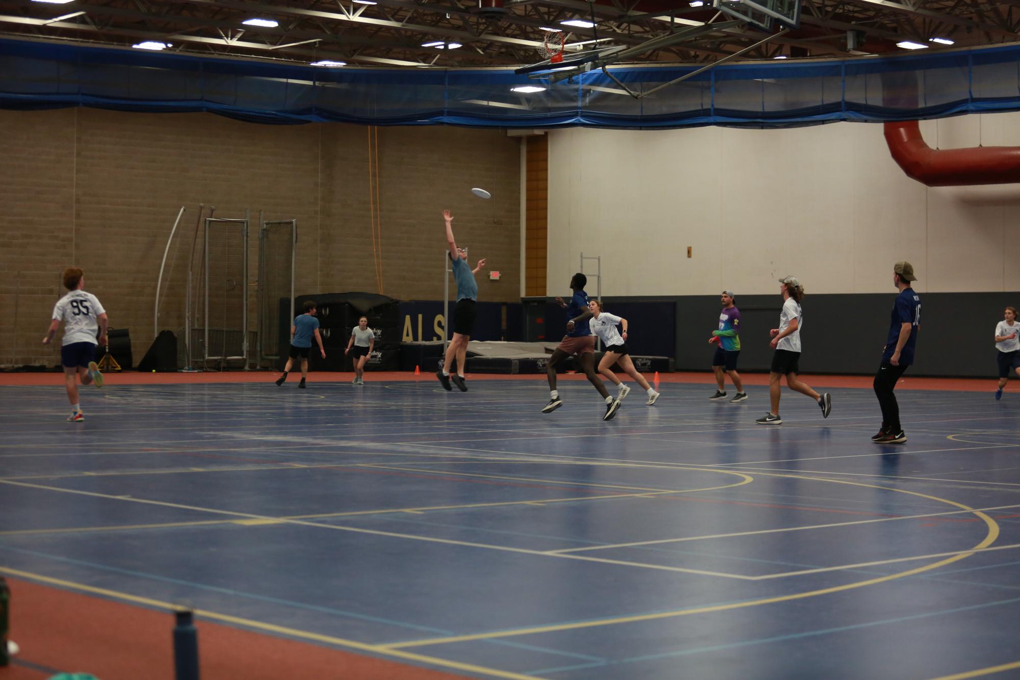 After running through a couple of warm-up drills the Bethel Ultimate Club team begins to scrimmage at their practice in the Sports and Recreation Center on Wednesday, Nov 11. Jeriah Young attempts to tip the frisbee away from the other team. “The program has had so much development this year… we have so many super passionate freshmen and new members on the team that the trajectory is definitely upward,” Shady said. 