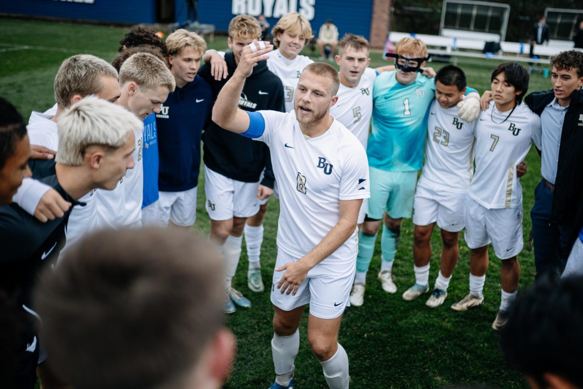 Fifth year captain Will Swanda rallies the Bethel University men’s soccer team before the first home MIAC playoff game in team history against Carleton College. The Royals went on to lose to the Knights by a score of 5-2 putting an end to one of the most successful seasons in team history. “One of the things we talk about as a team quite frequently is, you need to be in big games in order to win them next time.” Will Swanda said. | Photo by Bethel Athletics. 
