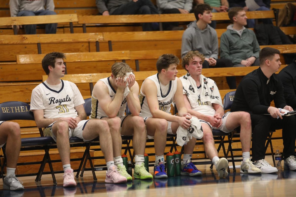 Bethel's depleted bench looks on during the team's 73-56 loss Saturday. Over the past two weeks, three Royals have dropped out from the team. 