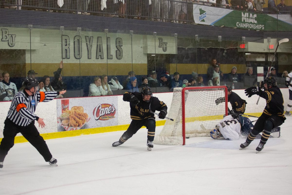 St. Olaf junior forward Jonathan Panisa scores the third-seeded Oles’ third goal of the MIAC semifinal game against second-seeded Bethel University Saturday, March 1 at the National Sports Center. Bethel led by one goal for most of the game, but the Oles responded in the third period with three goals in the span of nine minutes and 11 seconds. “They hang around until we make a mistake,” Royals head coach Chris Mckelvie said. “And it’s kind of a mirror image of last year in the playoffs.” 