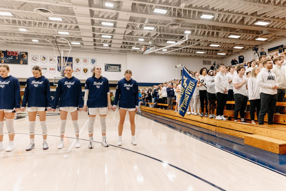 The Bethel University women's basketball team lines up side-by-side with Bethel's student section. Energy was high during the MIAC championship Saturday, thanks in large part to the student section. 