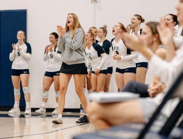 Junior setter Ellie Van Namen celebrates a point for the Bethel University volleyball team. Bethel's team culture and success attracted Van Namen to play for head coach Gretchen Hunt and now, despite an injury, she leads this year's large freshman class in playing important roles on the team off the court. "People are so young who are playing; that's a little bit harder," Van Namen said. "It will also be cool to see later in the season who steps up to that challenge." 