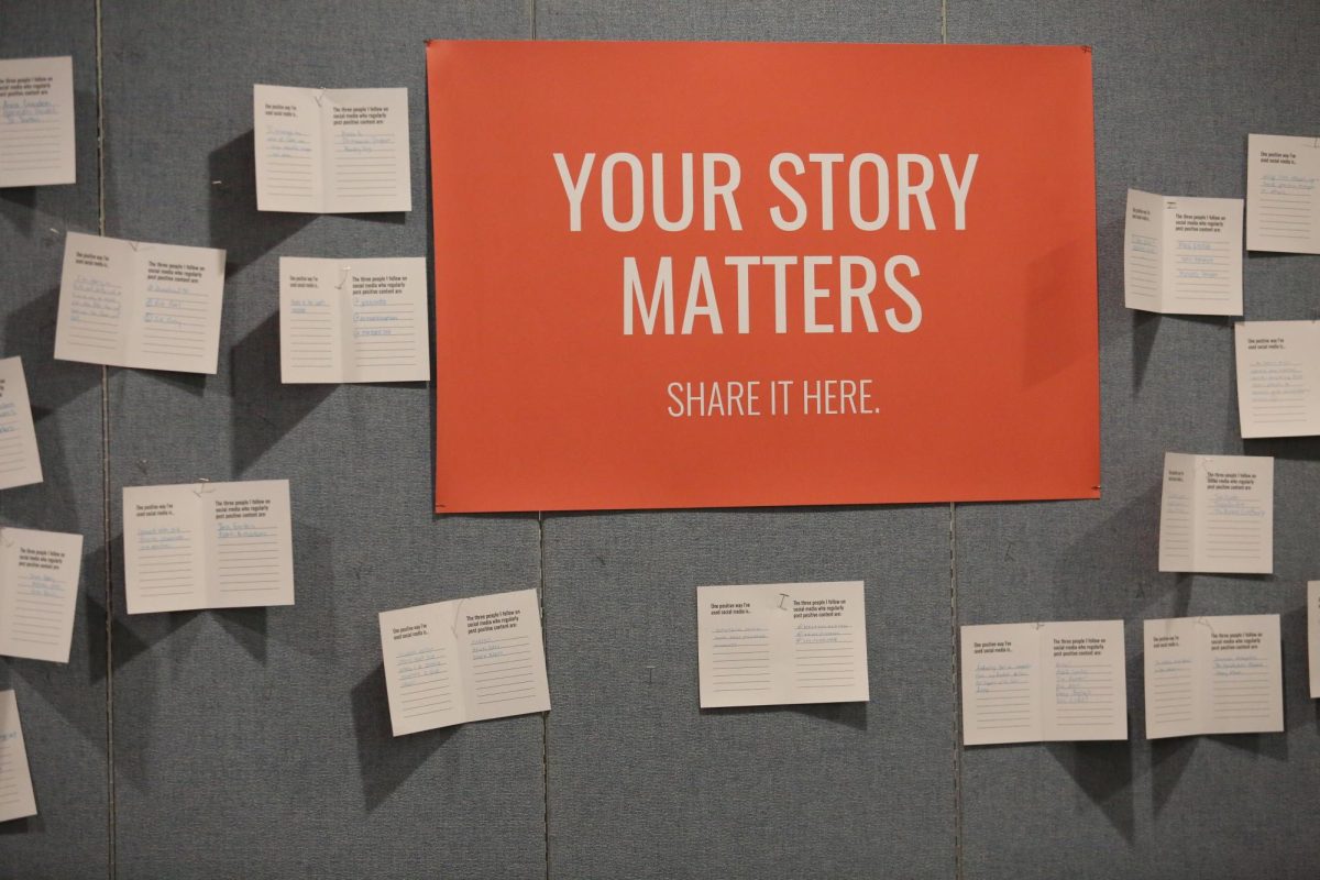 Audience members wrote notes on a panel outside of the Benson Great Hall on how they use social media for good and who they follow that brings positivity to their platform. 