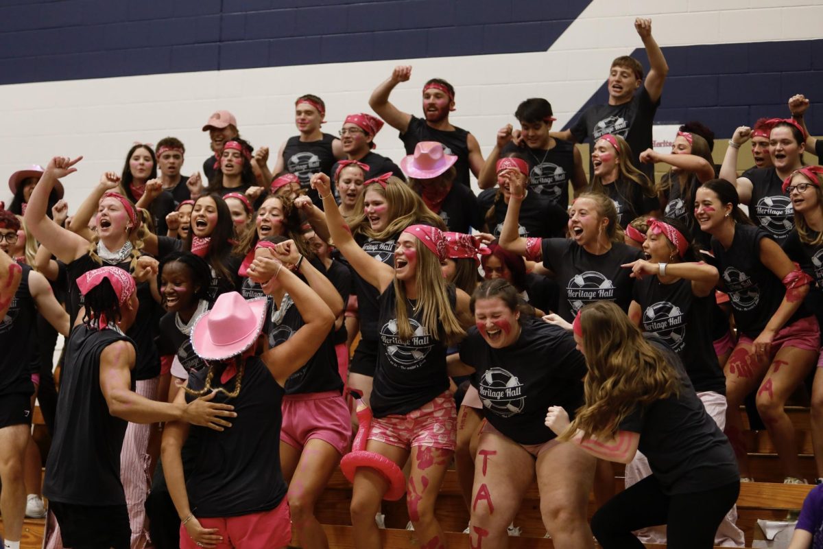 Heritage Hall leads a dorm cheer Oct. 13, 2025, in the Robertson Center gym at Bethel University. 