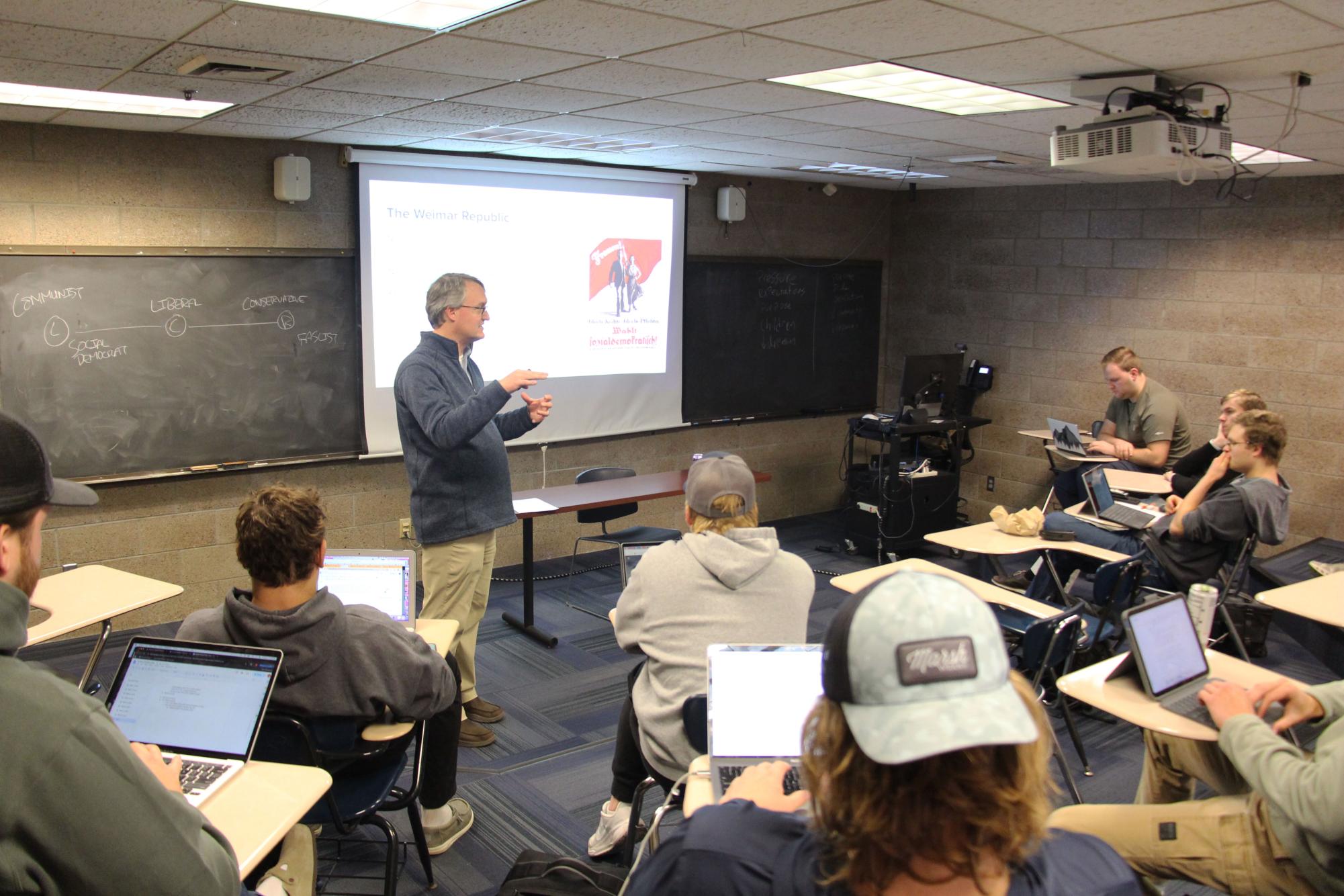 Bethel University history, philosophy and political science professor Chris Gehrz stands in the front of the classroom and lectures to the students in his Modern Europe History class Nov. 7, 2025.