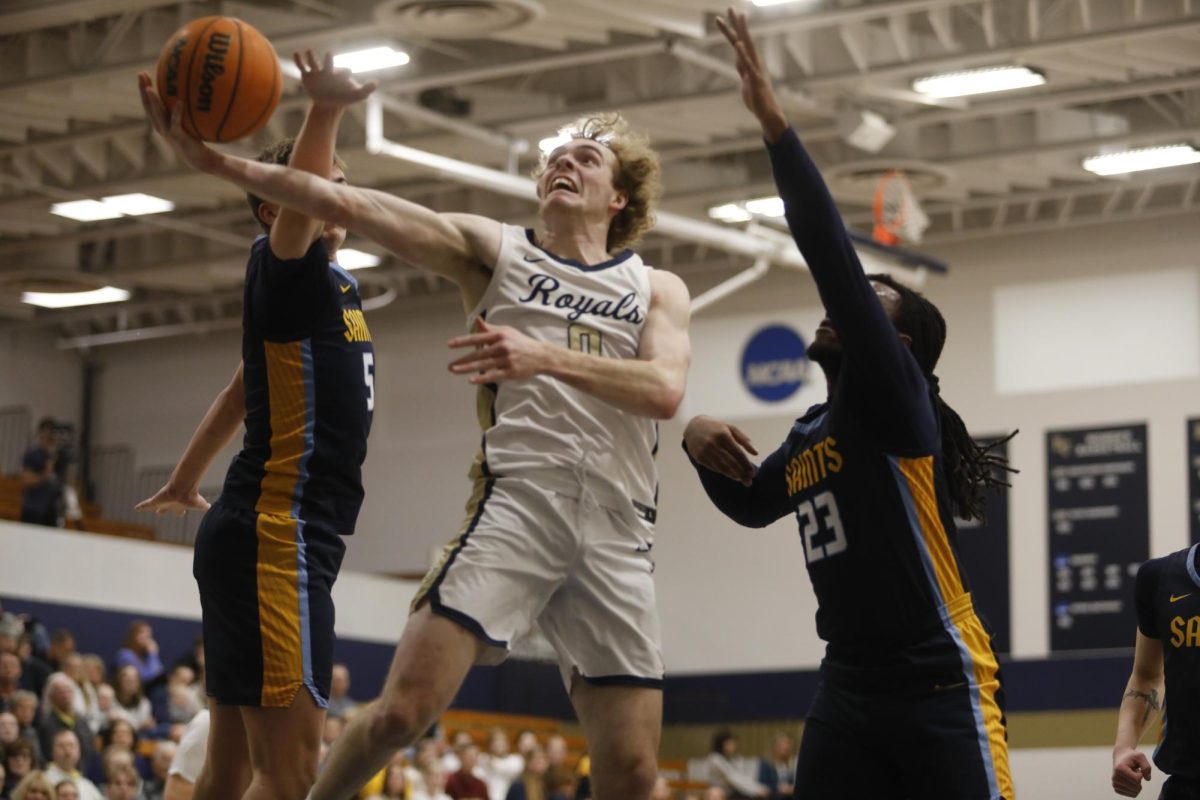 Bethel junior guard Blake Schmitz lays up a shot in the lane during the Royals' 85-70 win over St. Scholastica. Schmitz led all scorers with 26 points in the win. 
