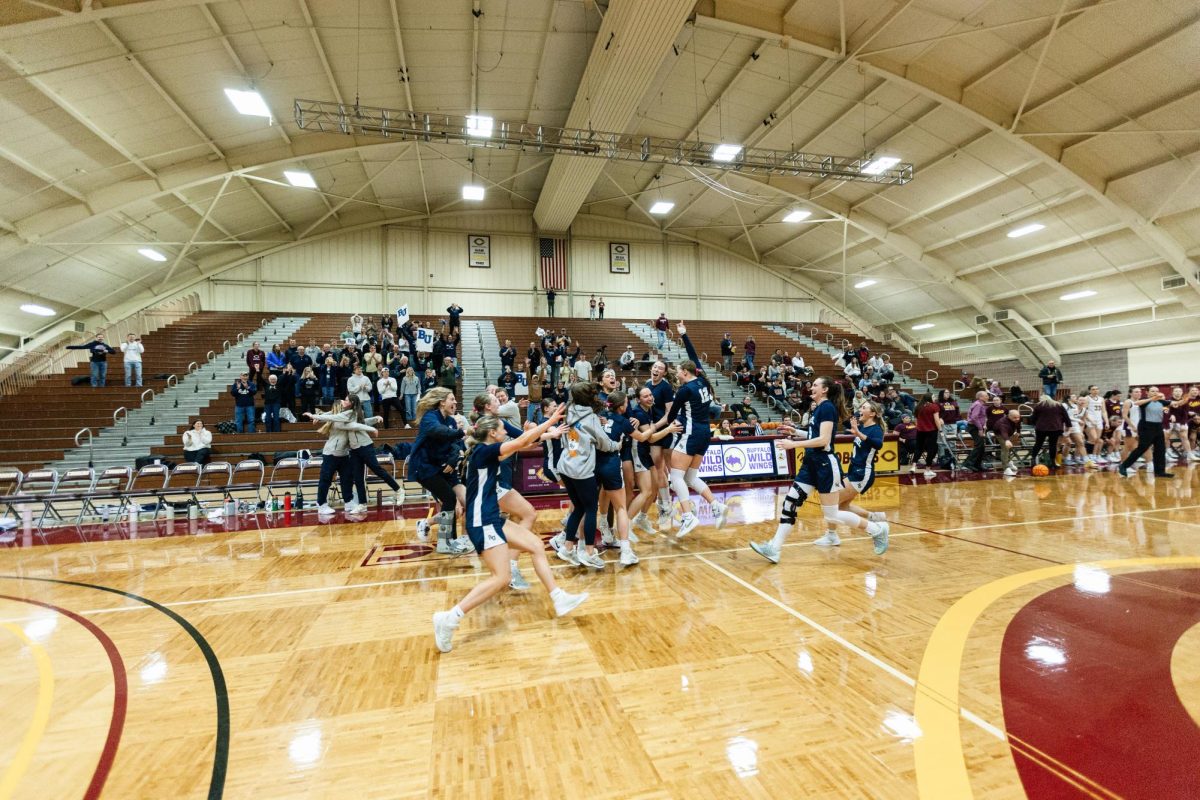 Players Bethel University's women's basketball team mob each other following the final buzzer of Saturday's MIAC championship. The 62-55 victory marks Bethel's second program championship and first since 2020. 