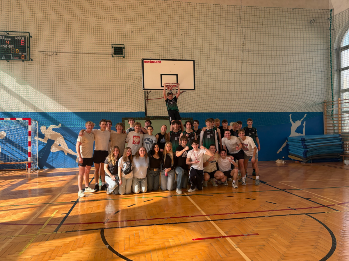 Bethel's 2026 Poland mission trip team members and the Zespół Szkół nr 8 im. Stanisława Staszica basketball team pose for a group photo after playing a game of basketball in the school’s gymnasium. | Photo submitted by Jillian Nelson