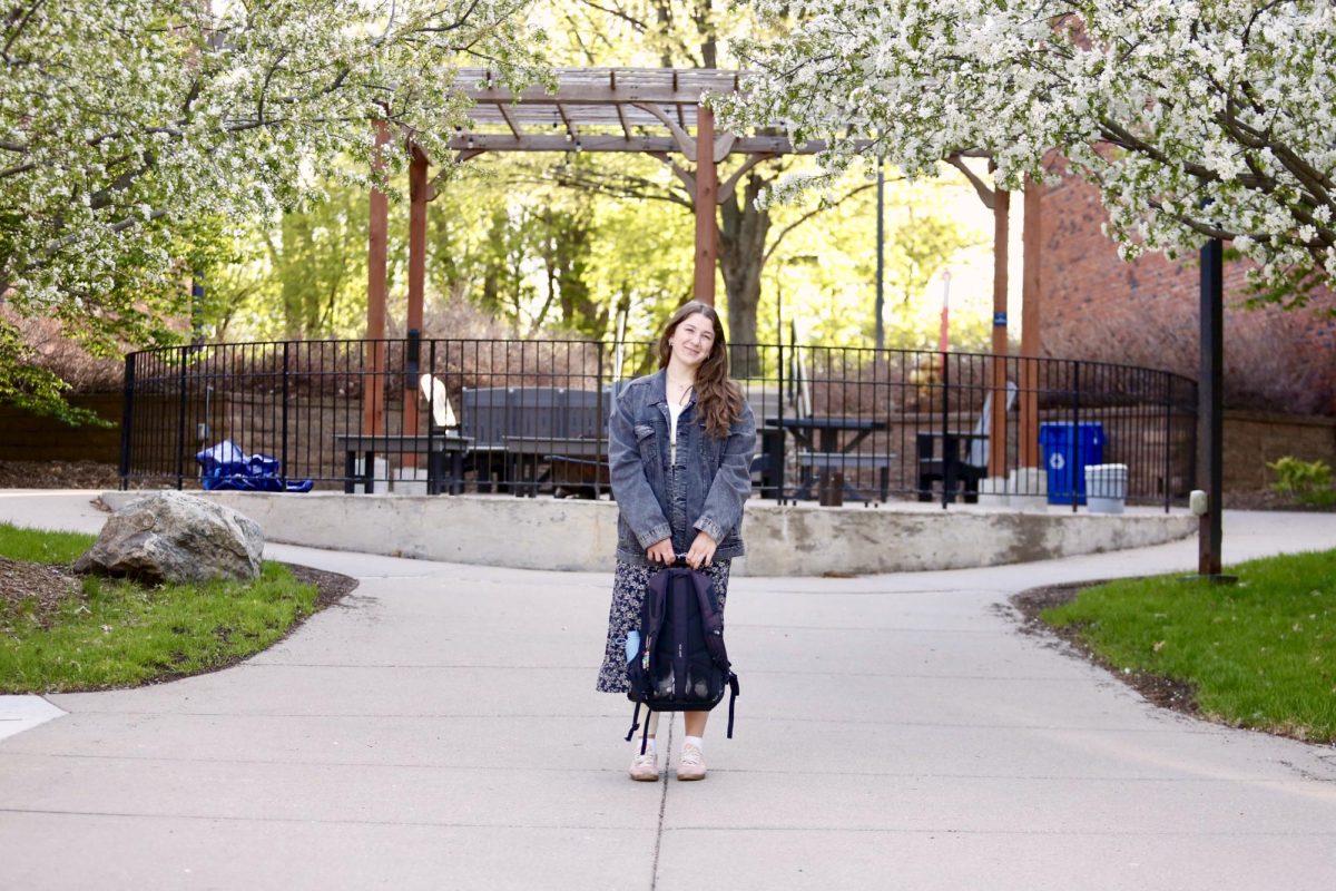 Mikiah Krieg stands on Bethel University's campus with her North Face backpack April 30, 2026. 